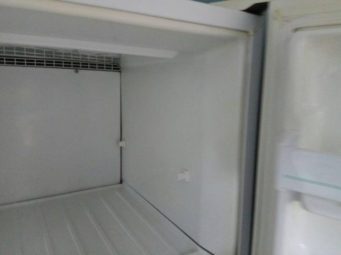 Freezer interior cleaned white and empty