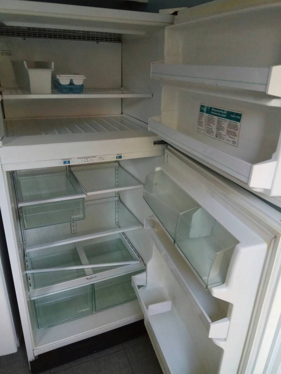 Refrigerator with shelves and drawers cleaned out